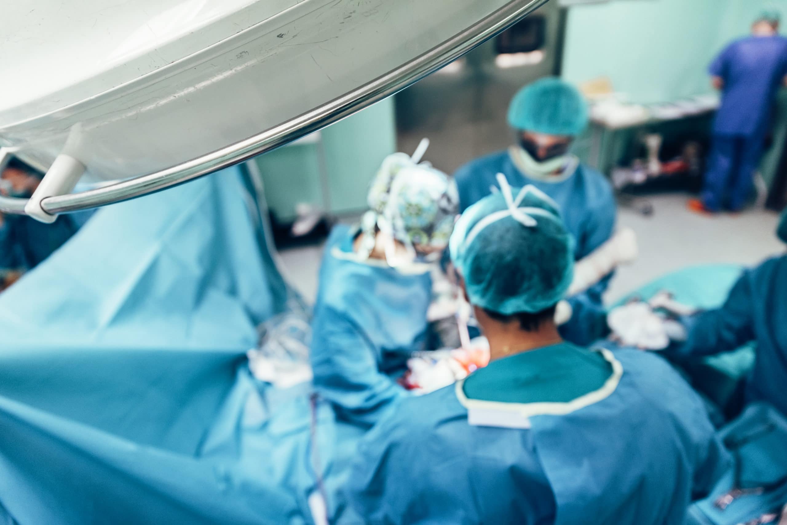 Team of Surgeons Operating in the Hospital.